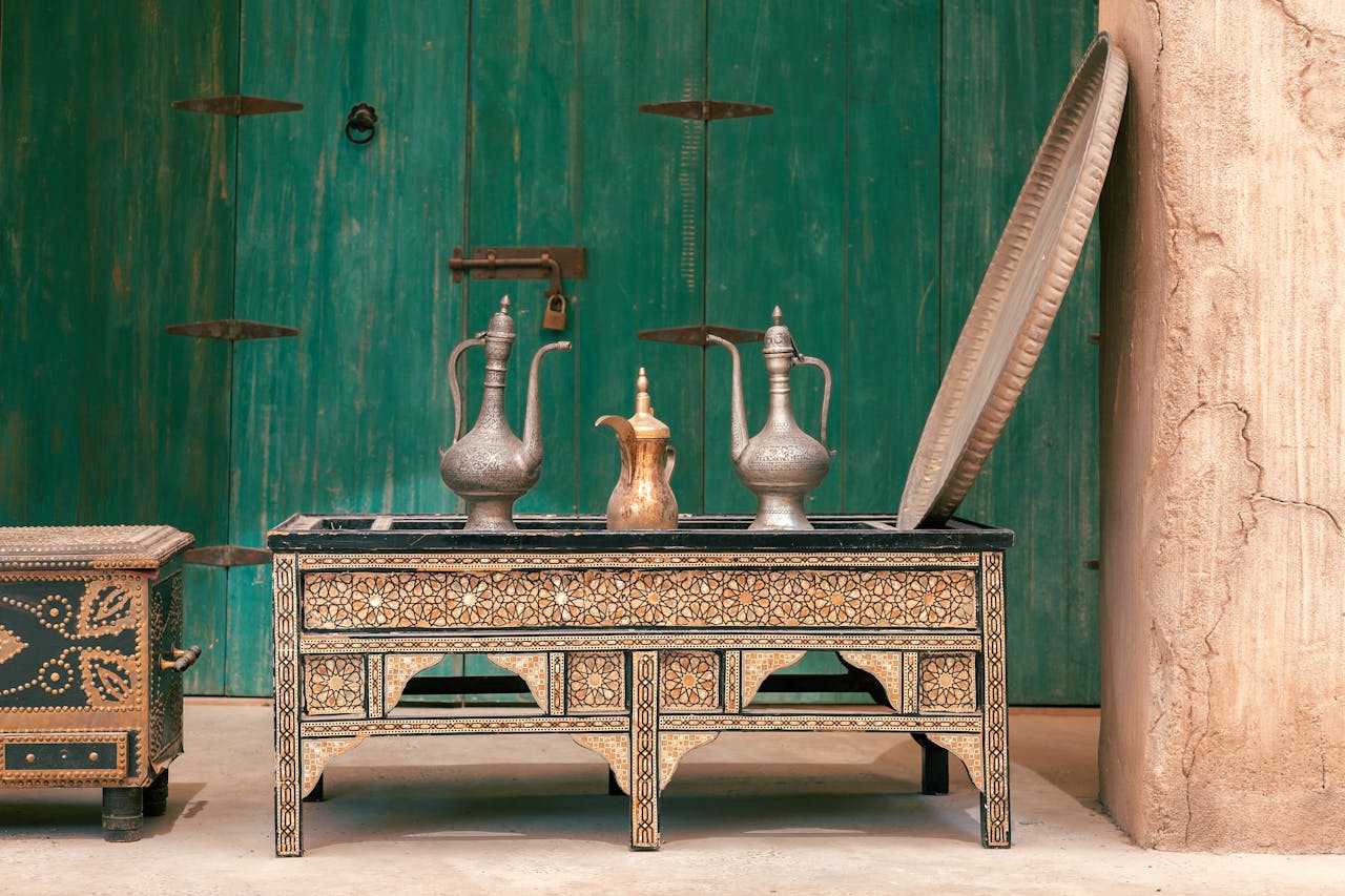 Intricately designed ablution jars on a decorative table in Dubai, showcasing Arabian artistry.