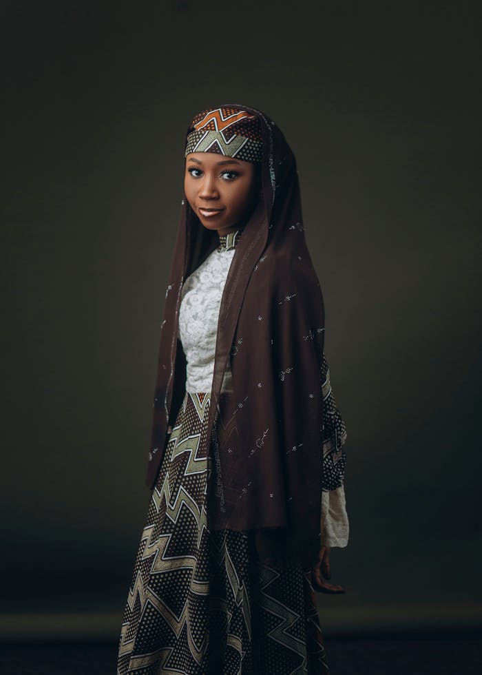 A striking portrait of a woman wearing traditional African attire, showcasing cultural heritage and elegance.